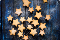Star cutouts on blue wood background